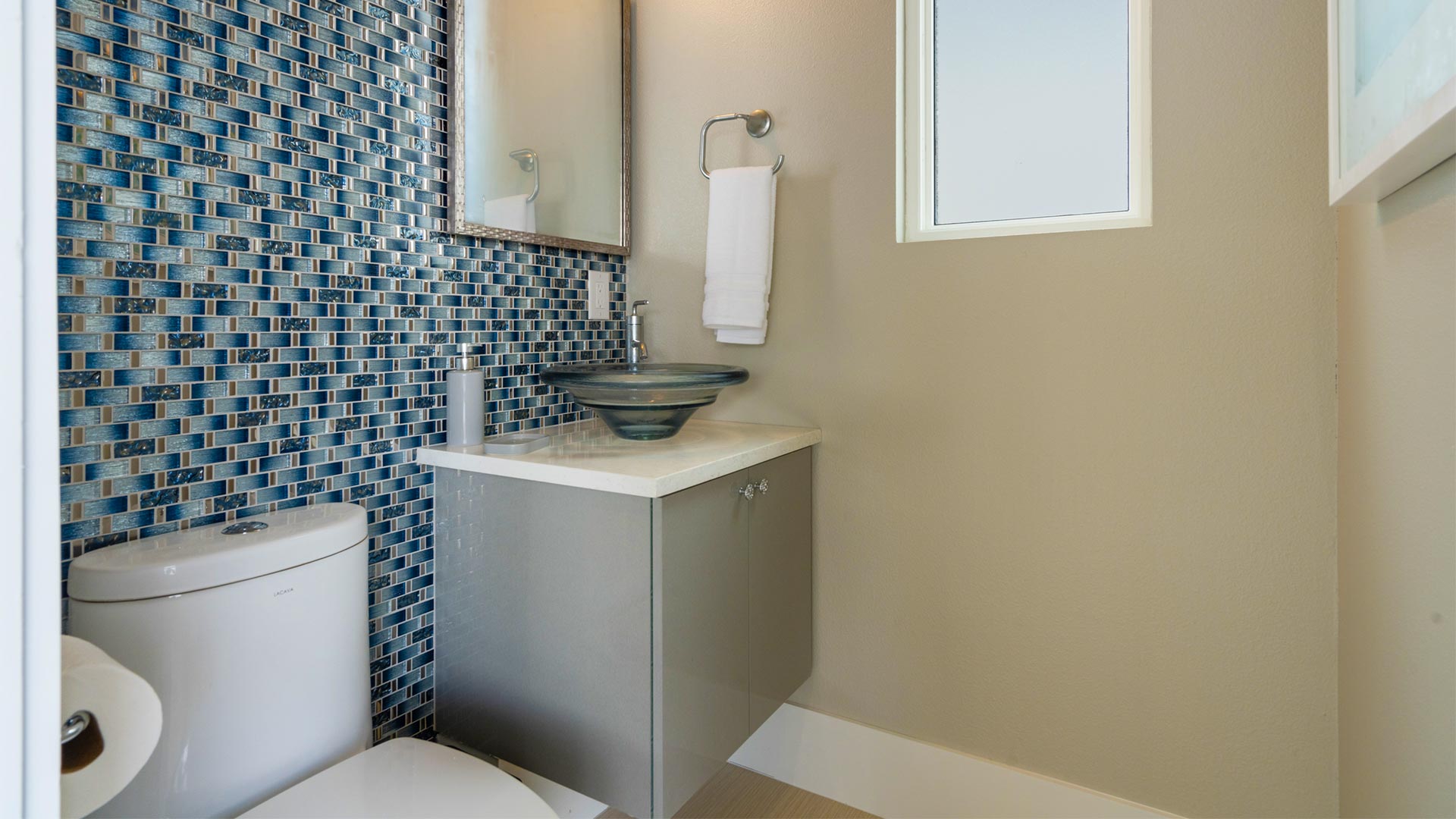 Bathroom Next To The Pool With Modern Plumbing Fixtures